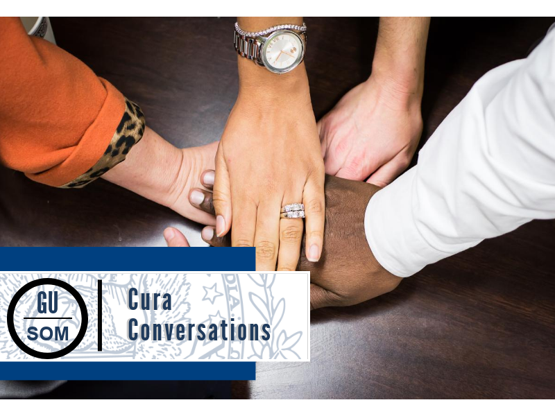 ODI Staff members with hands stacked on one another. Staff members are in circle. Hands feature hands from different ethnicities and races, genders, and age. 