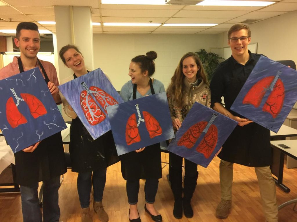 Harley Society members hold pictures of lungs