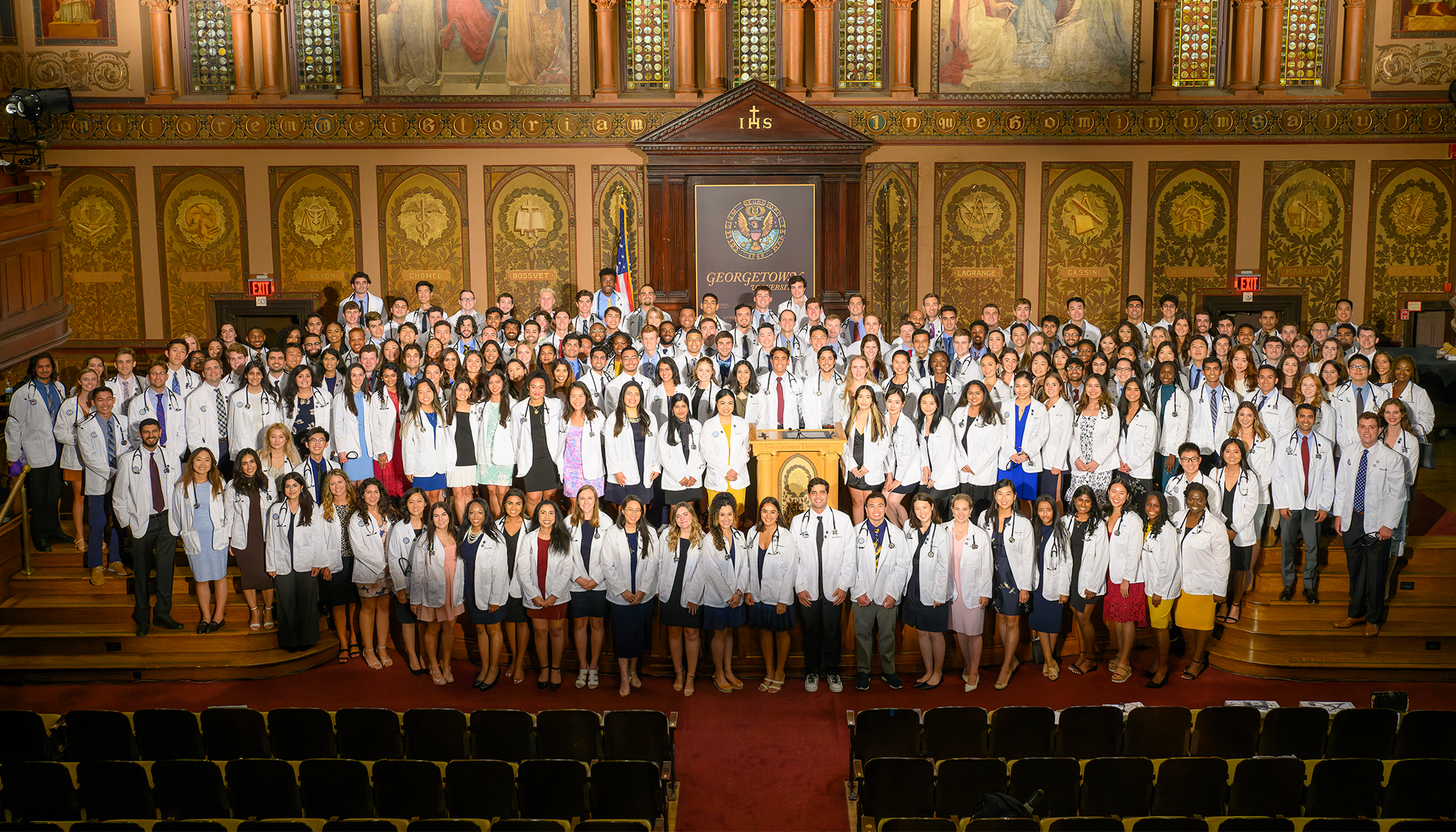 The 208 members of the Class of 2026 stand together in Gaston Hall
