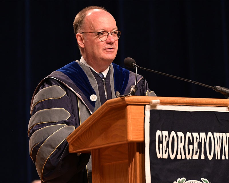 President DeGioia speaks at a podium