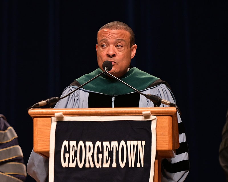 Dean Jones speaks at a podium