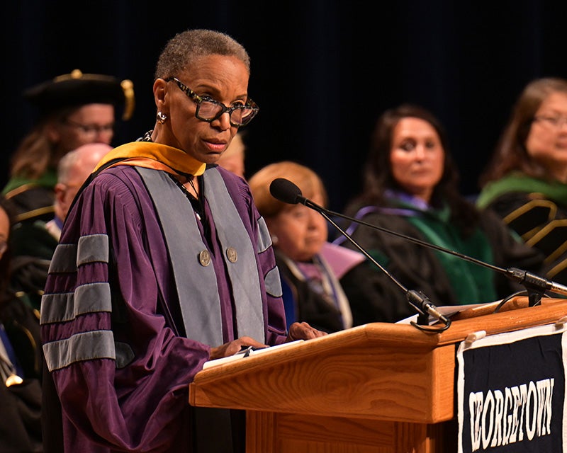 Dr. Reede speaks at a podium