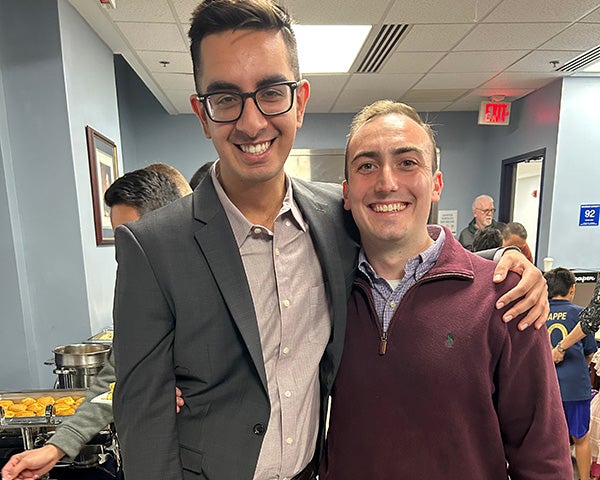 Two medical students stand together during the event