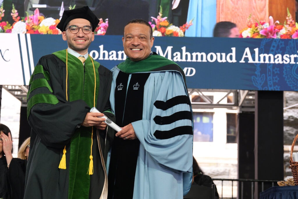 Almasri accepts his diploma from Dean Jones