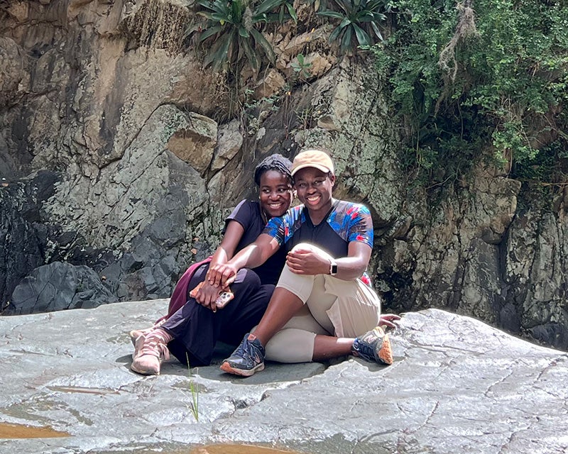 Phoebe Y. Ato and Rukewe H. Kehinde sit together