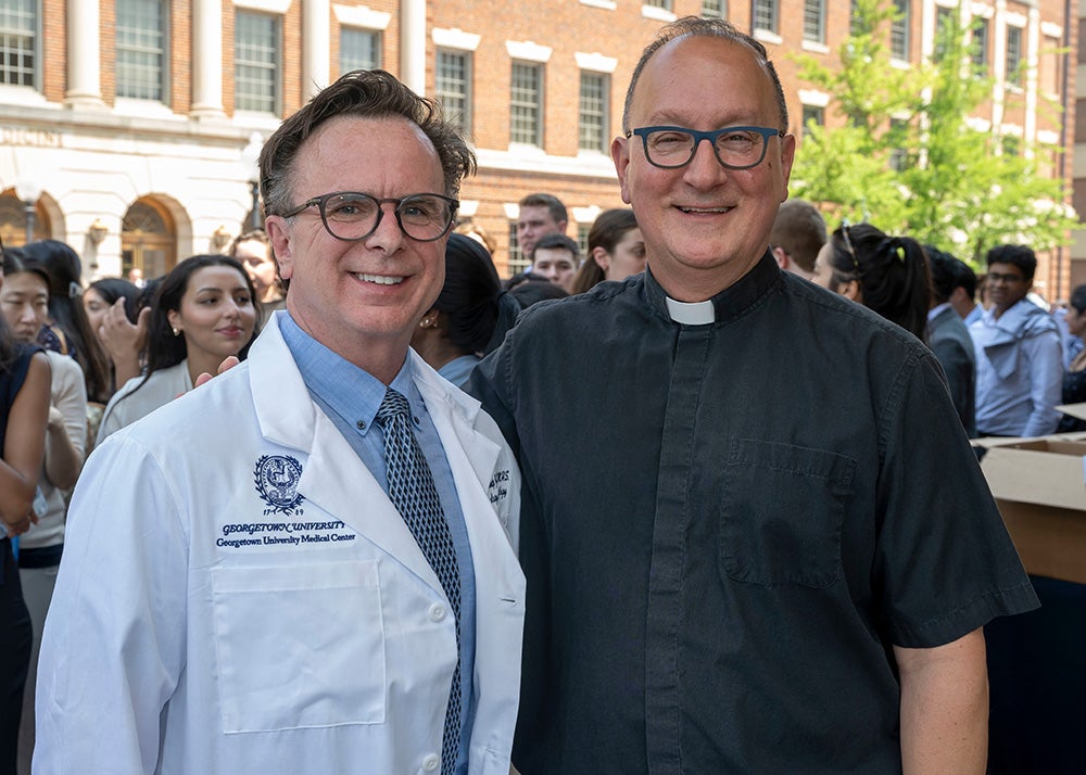 Norman Beauchamp and Father John Bosco