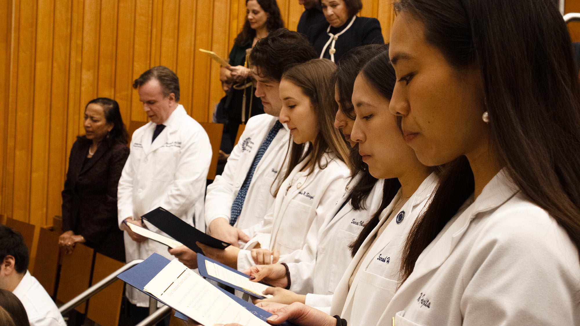 Students at the Gold Humanism Society ceremony recite an oath