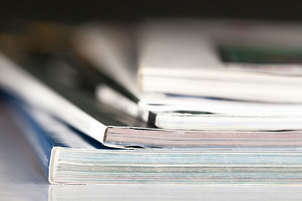 A closeup view of a stack of magazines